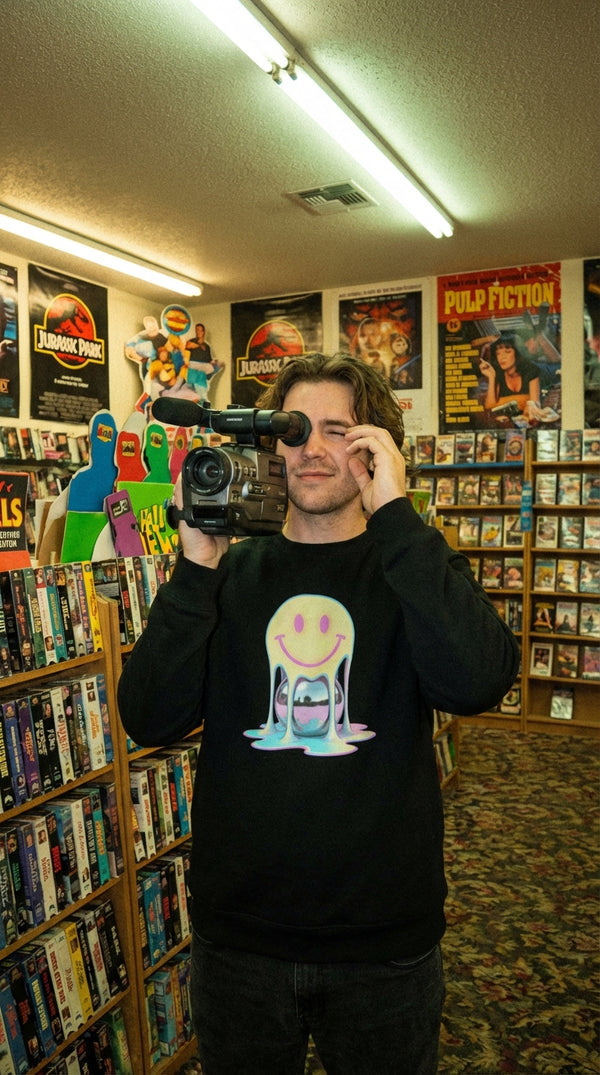 Melted Chrome Smile Organic Sweatshirt - VHS Camcorder Operator in VHS Rental Store - 90s Retro Sustainable