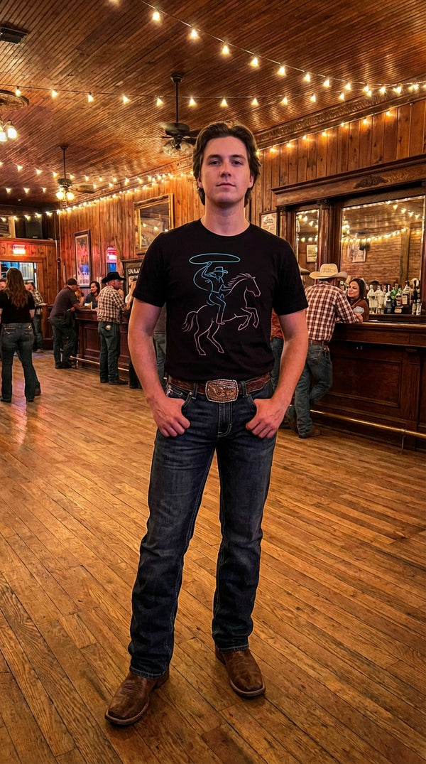 Organic Cotton T‑shirt – Neon Cowgirl and Bucking Horse - Line Dancer in Saloon Interior - 90s Retro Sustainable