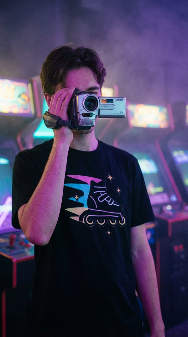 Neon Speed Racer T-Shirt | Retro Rollerblade Graphic Tee - VHS Camcorder Operator in Neon Arcade Alley - 90s Grunge Revival