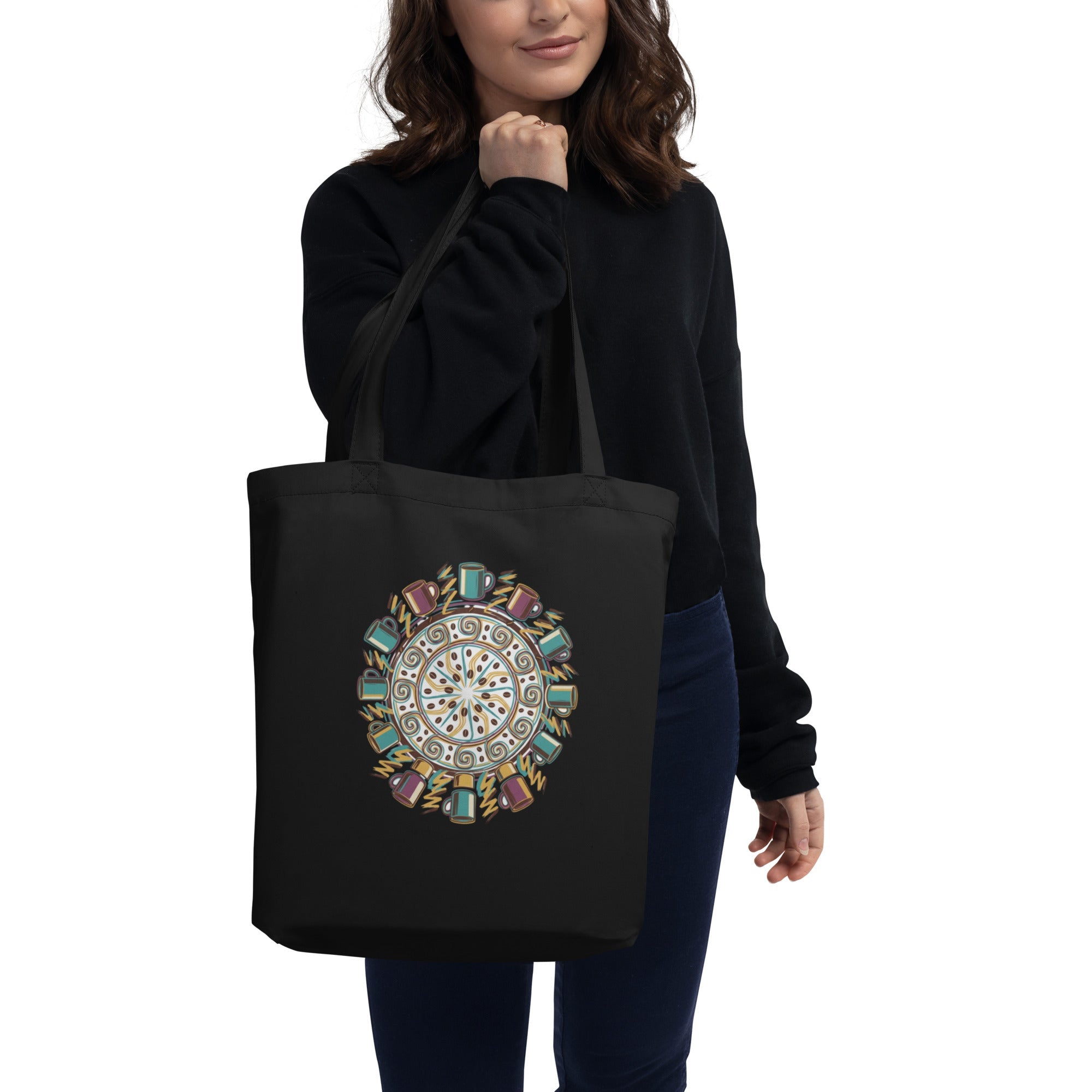 Black organic cotton tote bag, front view, showing a subtle weave texture under soft, diffused light.