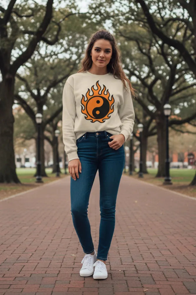 Model in yin-yang sweatshirt, harsh overhead light, slight film grain, texture of worn cotton.