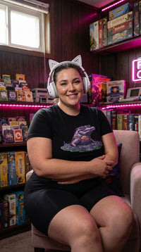 Neon Gator GOTS-certified organic cotton tee worn in a cozy game den — organic vaporwave