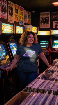 Neon Saturn with Glowing Rings Retro Space Graphic T-Shirt - Retro Plus Arcade in Vintage Record Store - 90s Grunge Revival
