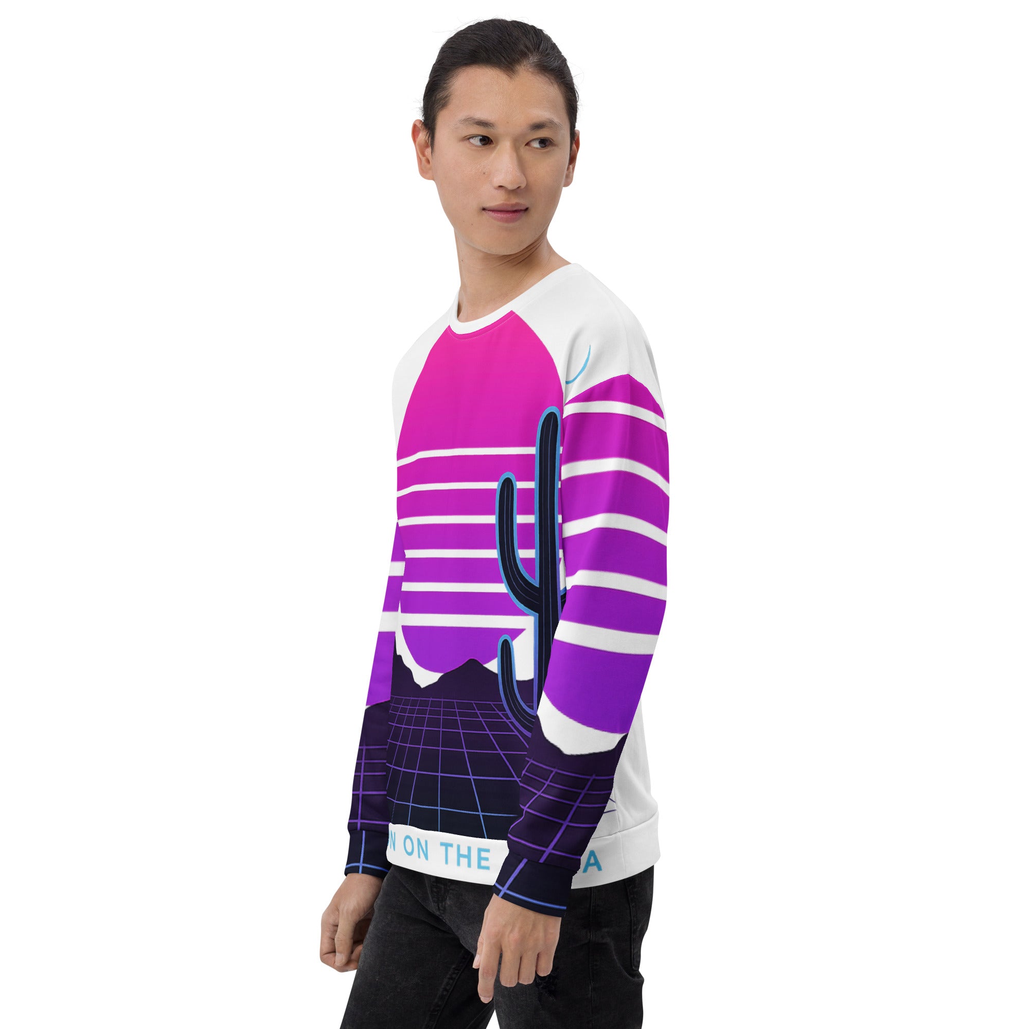 Person wearing a colorful long-sleeve shirt with a cactus design on a white background