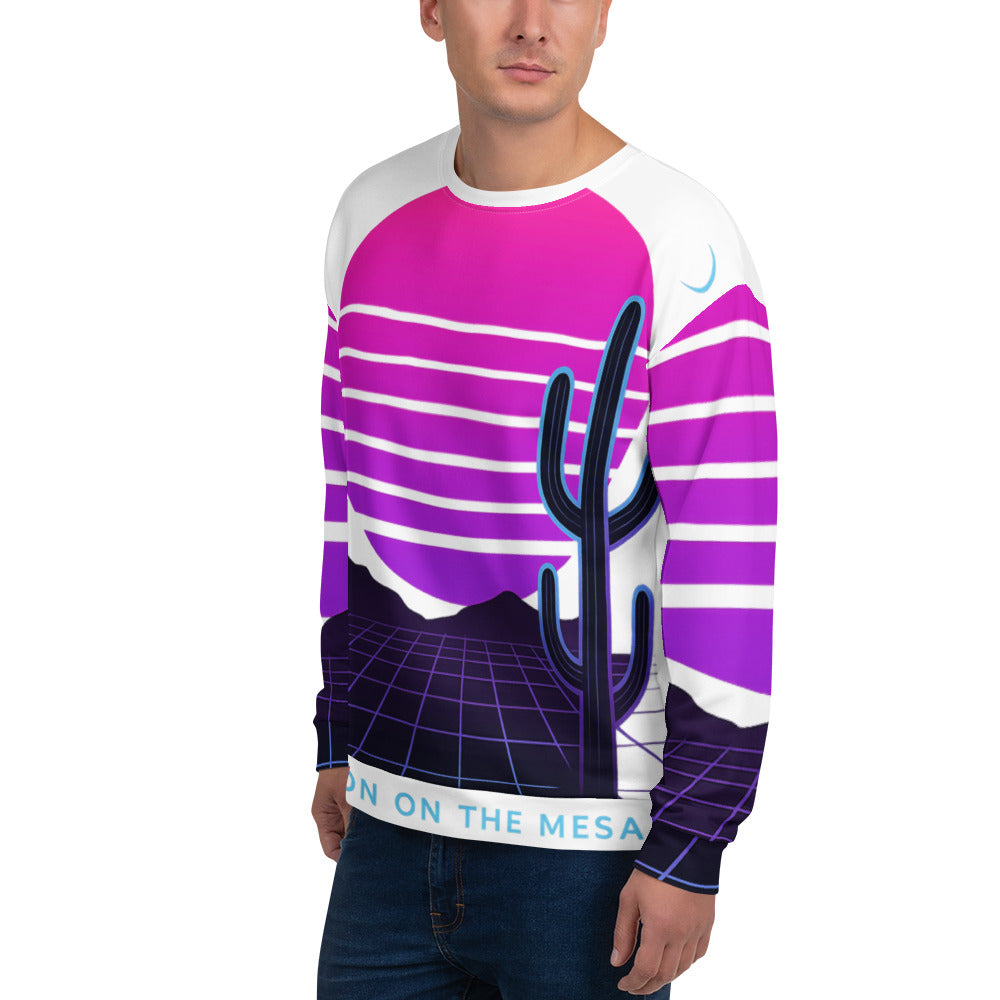 Person wearing a sweater with a cactus design and text on a white background