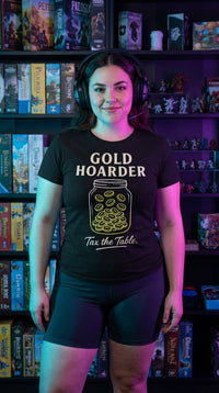 Gold Hoarder "Taxing Mage" GOTS-certified organic cotton tee worn in a local game store — the tournament grinder