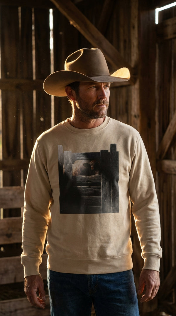 Rustic Bull Gate Organic Cotton Sweatshirt - Cowboy Model in Rustic Barn - Eco-Aesthetic Lifestyle