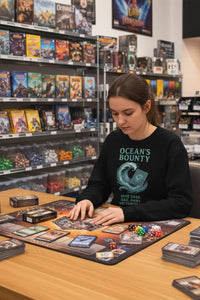 Woman playing a board game in a store with shelves of board games in the background