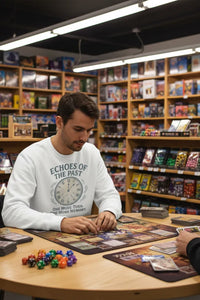 Man playing a board game in a store with shelves of games and books.