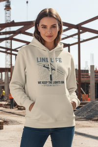 Woman wearing a hoodie with text in an outdoor setting