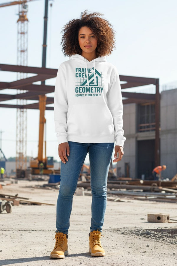 Person wearing a white hoodie with text, standing in an industrial setting.