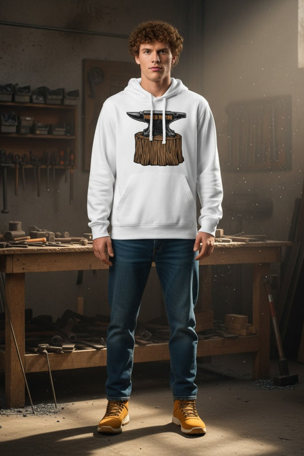 Person wearing a white hoodie with a blacksmith anvil design in a workshop.