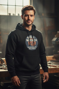 Man wearing a black hoodie with a logo and text in an industrial setting