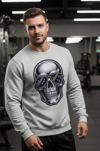 Man wearing a gray sweatshirt with a skull design in a gym setting