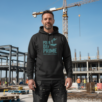 Man wearing a black hoodie with text at a construction site