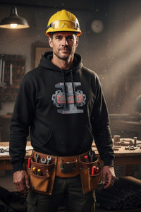 Man wearing a black hoodie with a logo and a tool belt in a workshop setting