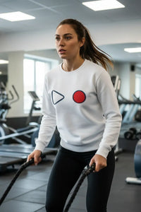 Woman exercising with resistance ropes in a gym setting