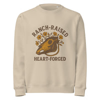 Beige sweatshirt with a graphic design of a horse skull and text on a white background