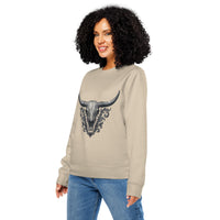 Woman wearing a beige sweatshirt with a graphic design on a white background